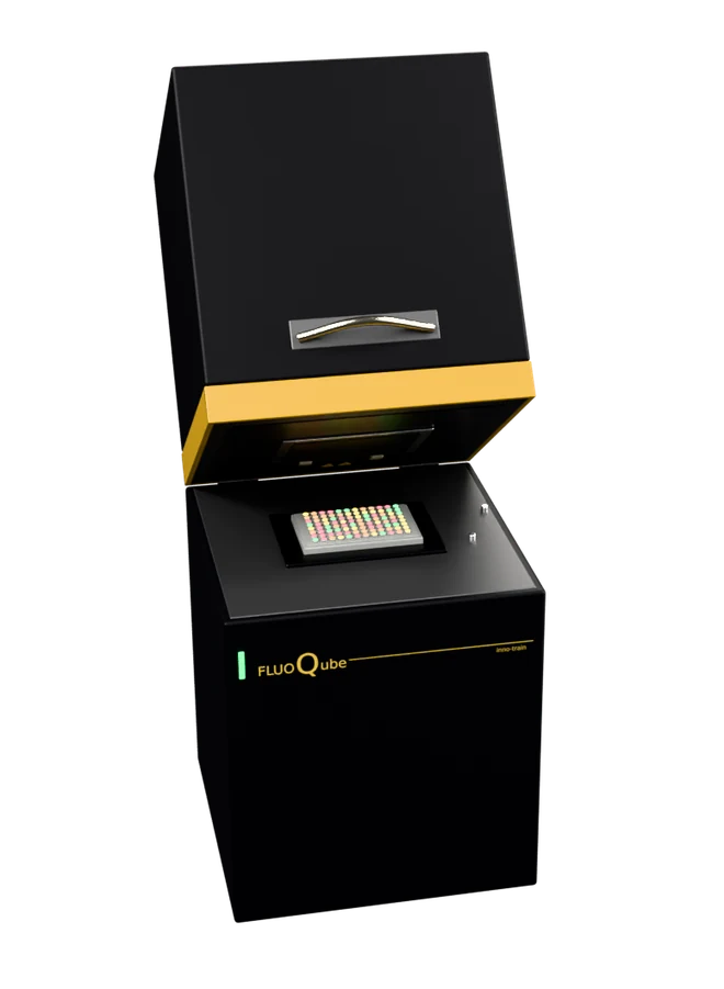 The FluoQube with its lid open and a FluoGene plate in the block